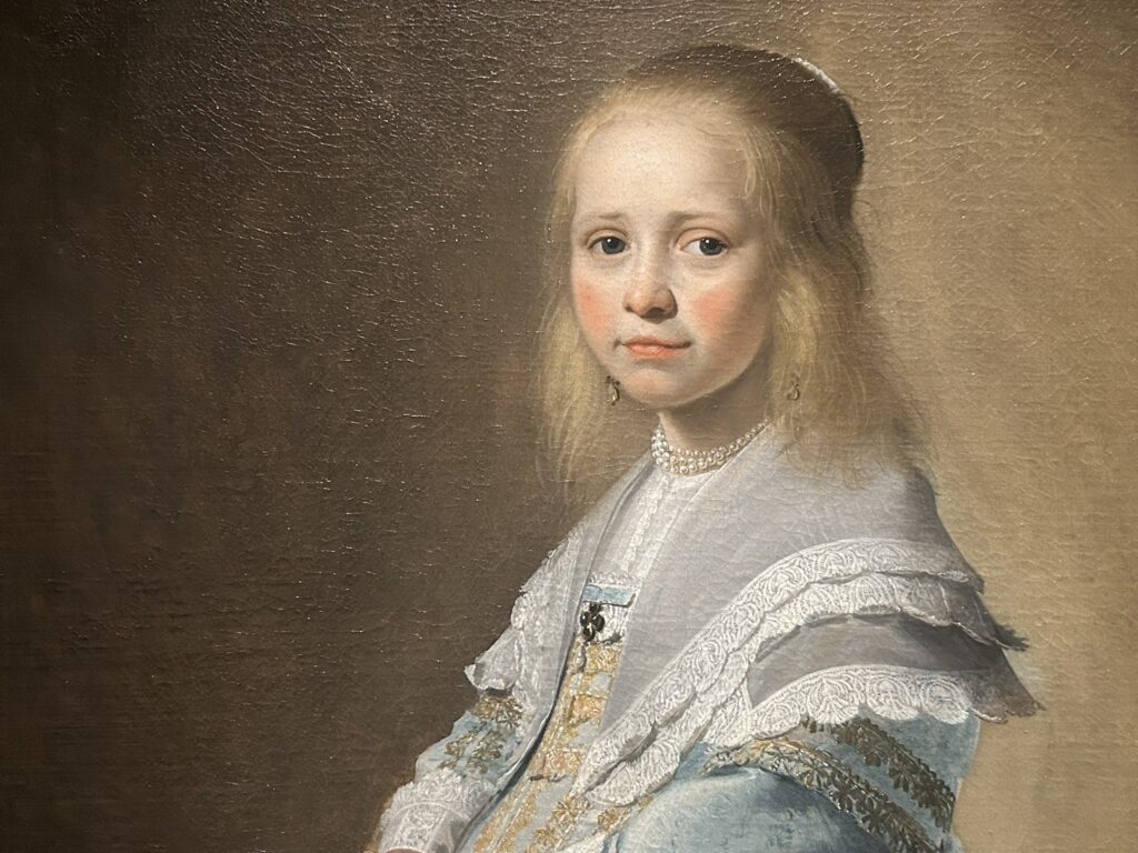 Wie was het meisje in het blauw?