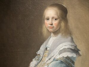 Wie was het meisje in het blauw?